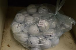 A bag of fifty Srixon golf balls.