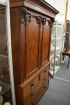 A Victorian mahogany linen press.