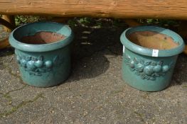 A pair of glazed planters.