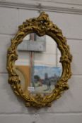 Decorative gilt plaster framed mirror.