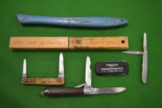 Three fisherman's knives, three pocket knives and an advertising knife.