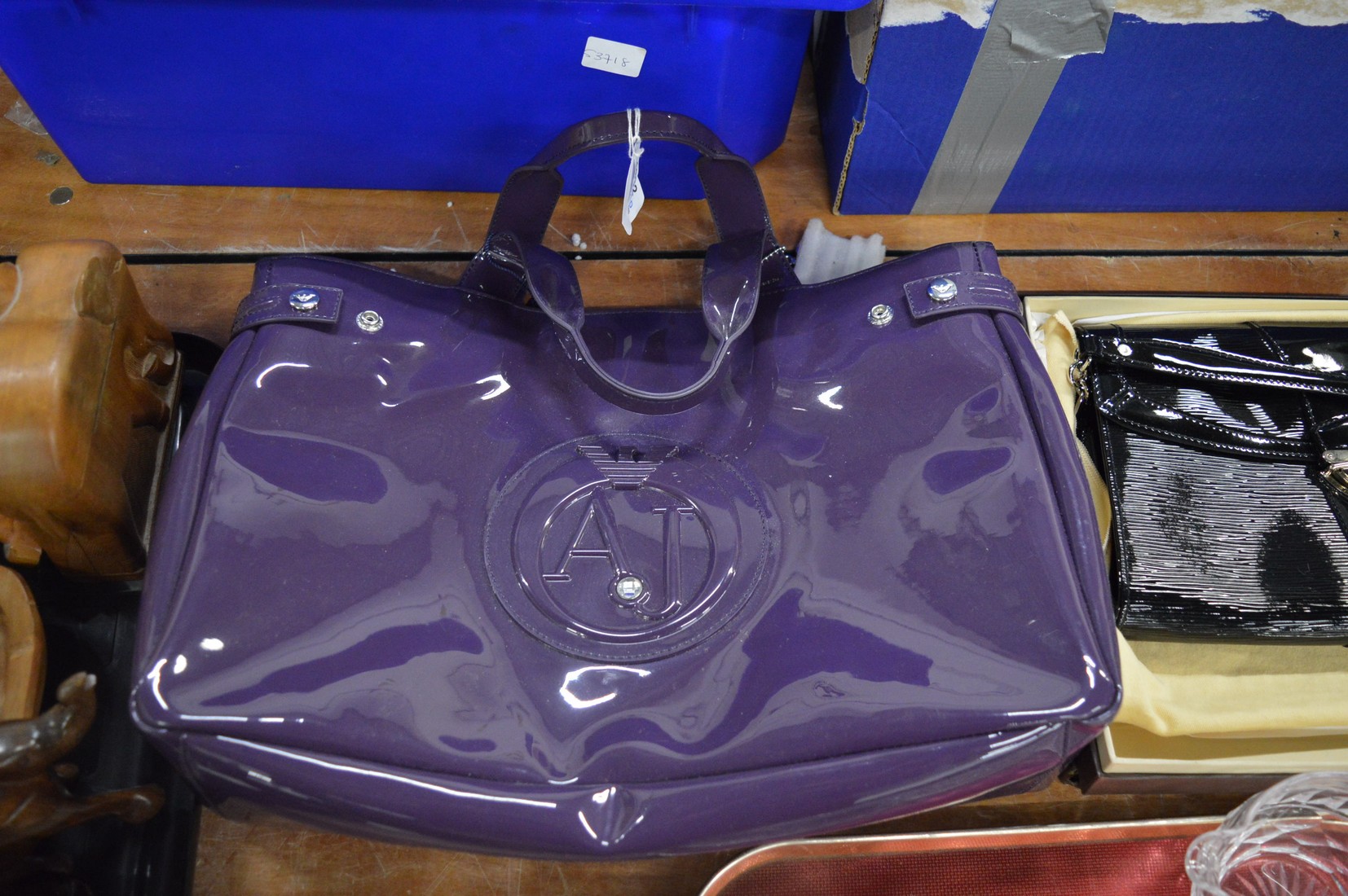 An Armani purple handbag.