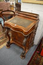 A Victorian walnut Davenport.