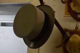 A grey top hat, size 7¾ x 6½.