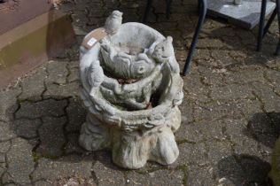 A reconstituted stone garden fountain.