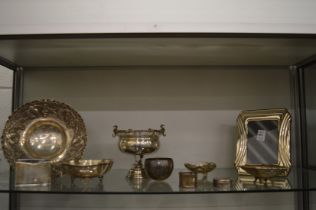 A collection of silverware to include an embossed dish, pedestal bowl, a photograph frame etc.