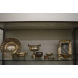 A collection of silverware to include an embossed dish, pedestal bowl, a photograph frame etc.