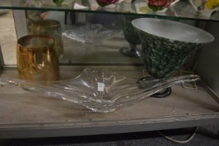 A large stylish clear glass dish and two other items.