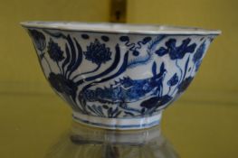 A Chinese blue and white bowl with shaped rim.