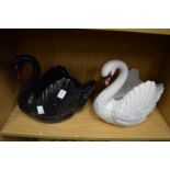 Two Dartmouth pottery swan shaped jardiniere's, one black, one white.