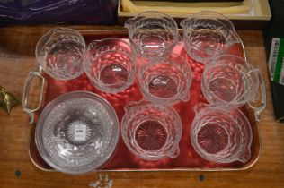 A set of eight cut glass wine rinsers with matching cut glass stands.