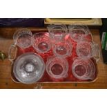 A set of eight cut glass wine rinsers with matching cut glass stands.