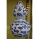 A large Chinese blue and white double gourd shaped vase.