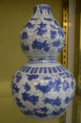 A large Chinese blue and white double gourd shaped vase.