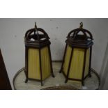 A pair of unusual mahogany and silk work hanging shades.