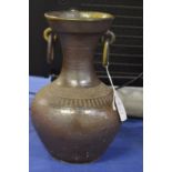 A salt glazed vessel with ring handles.