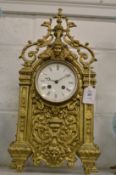 A large decorative brass mantle clock.