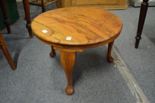 A walnut occasional table.