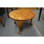 A walnut occasional table.