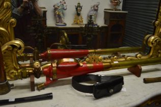 A brass and red painted brass fireman's foam making branch pipe.