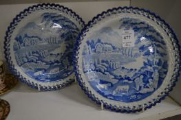 A pair of 19th century blue and white dishes with pierced borders (one dish cracked).