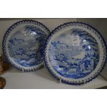 A pair of 19th century blue and white dishes with pierced borders (one dish cracked).