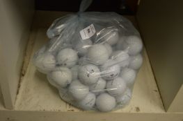 A bag of fifty Wilson golf balls.
