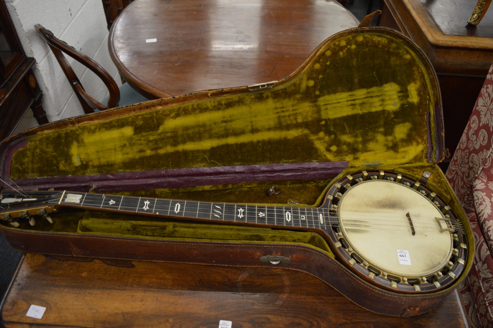 A very good Banjolele by A O Windsor, Birmingham in original leather case.