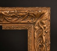 A 19th Century carved frame, rebate size 14" x 9.5" (36 x 24.5cm), cut down, a/f.