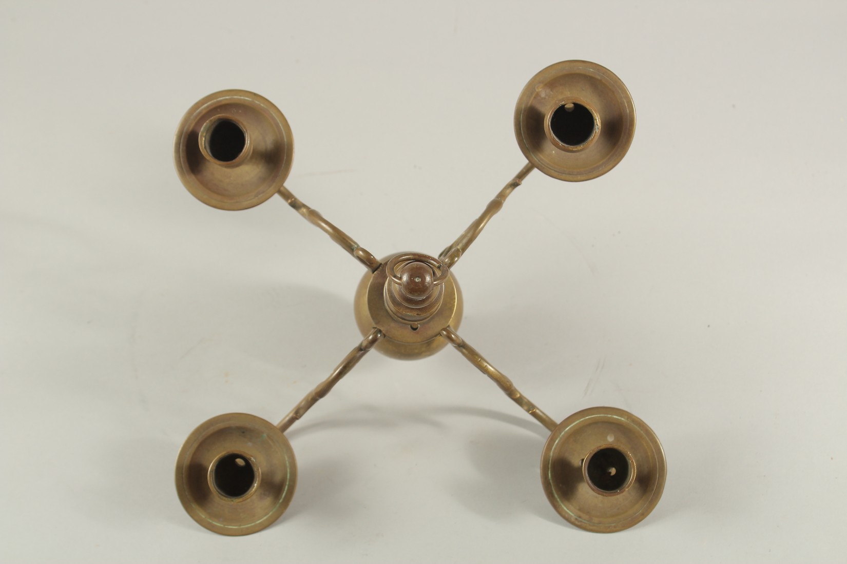 A FOUR BRANCH BRASS CANDELABRA. 11ins high. - Image 2 of 2