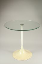 A 1960'S CREAM CIRCULAR GLASS TOP TABLE. 1ft 8ins diameter x 4ft 7ins high.