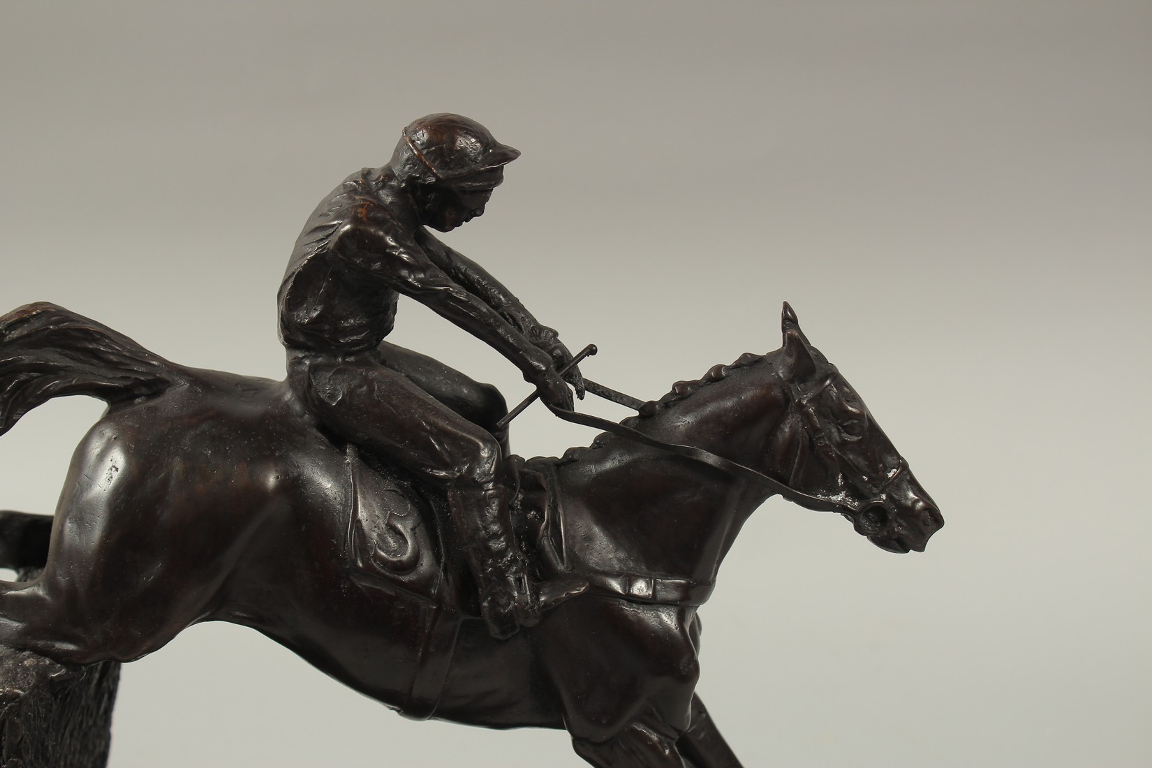 A FINE BRONZE GROUP, HORSE AND JOCKEY OVER THE FENCE, on a marble base. 12ins high. - Image 5 of 6