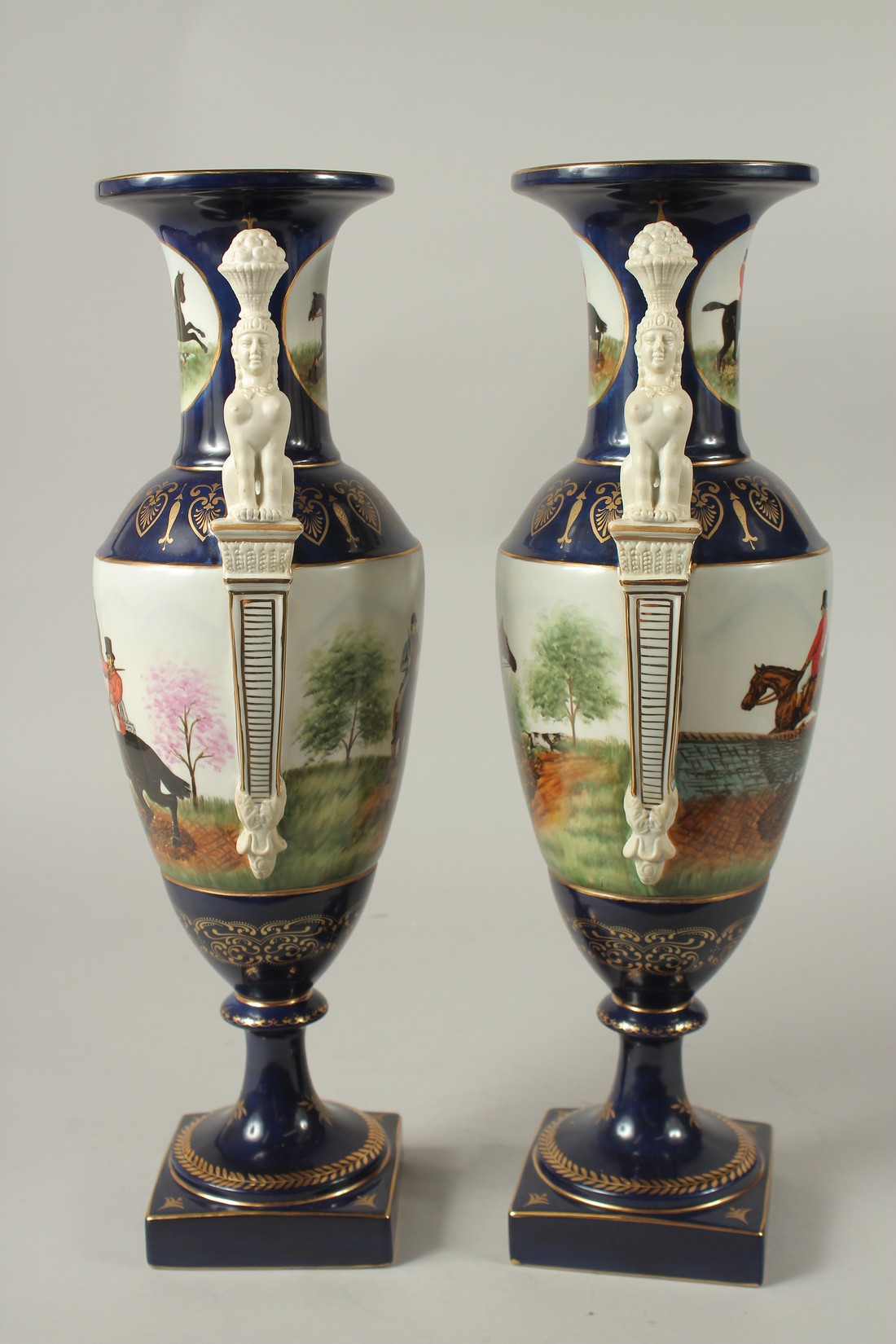 A PAIR OF SEVRES DESIGN BLUE GROUND TWO HANDLED HUNTING VASES. 46cms high. - Image 4 of 5