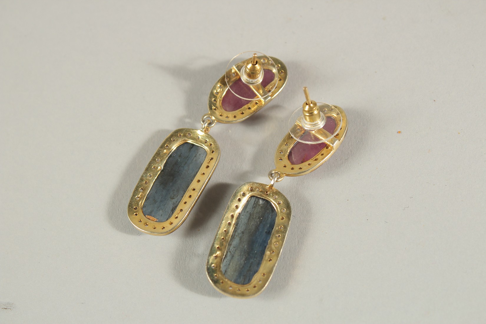 A LARGE ARTICULATED PAIR OF MIXED ROSE-CUT RED AND BLUE SAPPHIRE DROP EARRINGS IN SILVER GILT, - Image 2 of 2