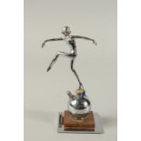 AN ART DECO CHROME DANCING LADY LIGHTER on a square base. 8cms tall.