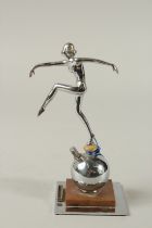 AN ART DECO CHROME DANCING LADY LIGHTER on a square base. 8cms tall.