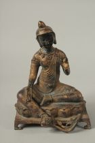 A CHINESE BRONZE SEATED CHINAMAN sitting on a bench. 24cms high.