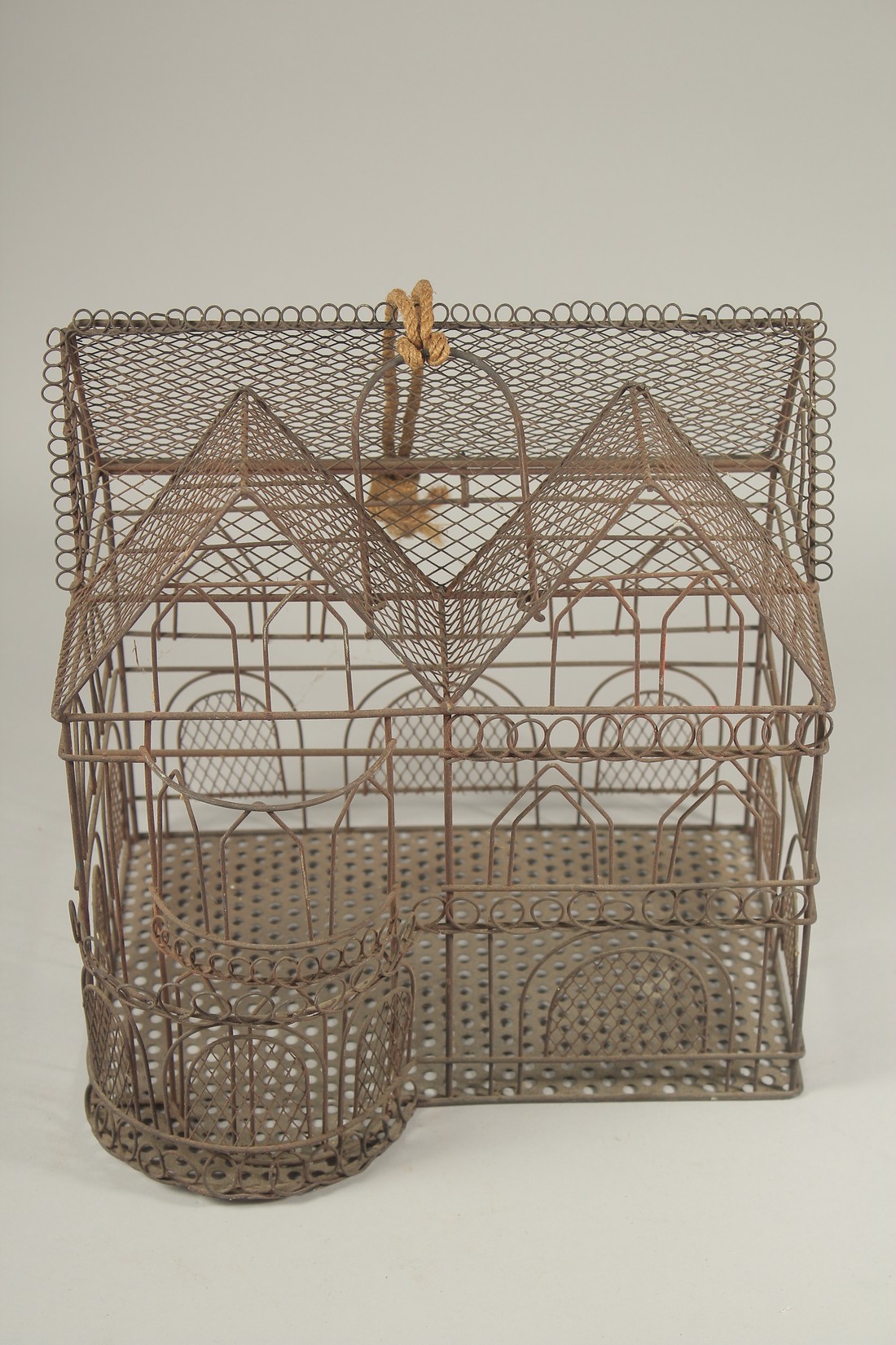 A WIRE WORK BIRD CAGE HOUSE. 12ins high x 11 ins long.