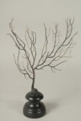 A BLACK CORAL SPECIMEN, 10ins high, on a stand.