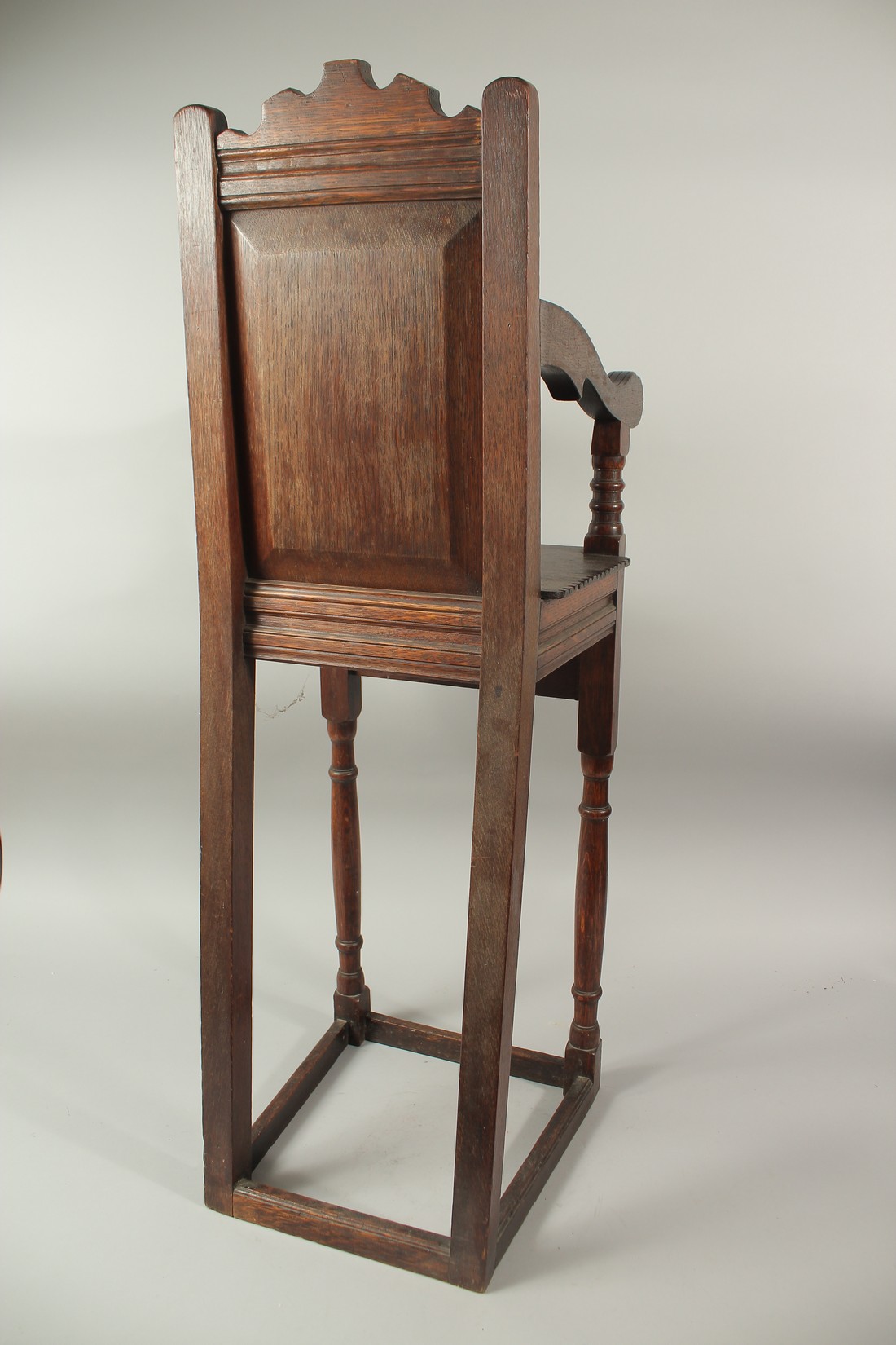 A CHILD'S 17TH CENTURY HIGH CHAIR, dated 1659, with carved back and solid seat. 3ft 6ins high x - Image 4 of 4