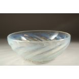 A LALIQUE CIRCULAR BOWL with spiral of fishes. 9.5cms diameter. Etched: R. Lalique, France.