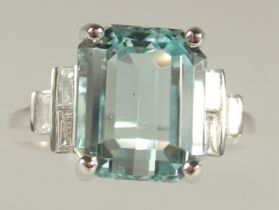 AN 18CT WHITE GOLD, AQUAMARINE 8CT RING WITH DIAMOND SHOULDERS.