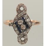 UNHALLMARKED ROSE GOLD ART NOUVEAU STYLE RING SET WITH CALIBRE CUT SAPPHIRES AND RBC DIAMONDS.