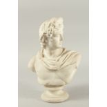 GRAND TOUR. A CLASSICAL MARBLE BUST OF A YOUNG MAN on a circular marble base. 13cms high.