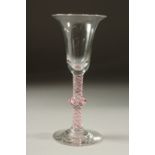A DUTCH WINE GLASS with inverted bell bowl and coloured twist stem and knop. 6.5ins high.