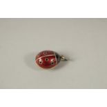 A RUSSIAN SILVER AND ENAMEL LADYBIRD PENDANT.