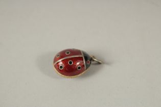 A RUSSIAN SILVER AND ENAMEL LADYBIRD PENDANT.
