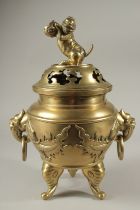 A LARGE CHINESE BRONZE TWO HANDLED CENSER AND COVER with dog of fo finial. 42cms high.