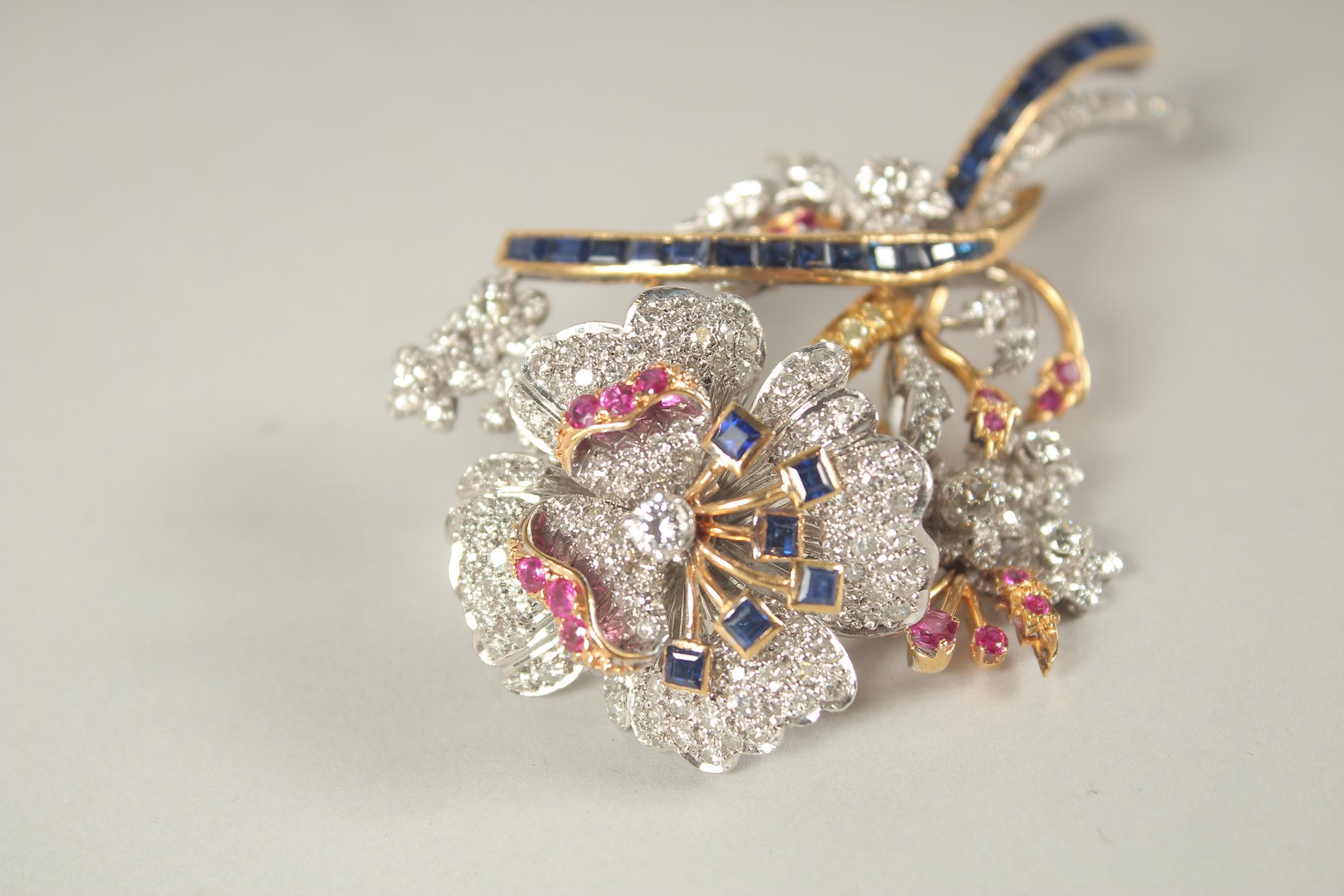 A SUPERB 18CT GOLD, DIAMOND, RUBY AND SAPPHIRE TREMBLING FLOWER BROOCH. 35grams. - Image 2 of 5
