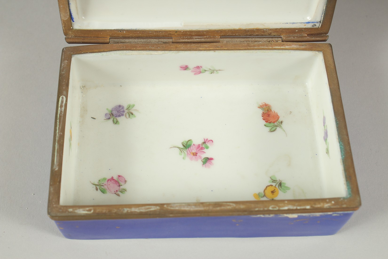 A SEVRES PORCELAIN BOX AND COVER with blue ground, with a panel of flowers. 5ins long. - Image 5 of 6
